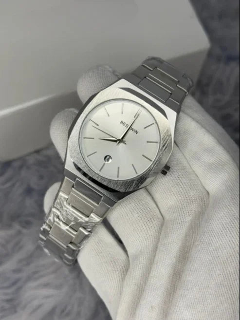 Bestwin Date Just Watch in Silver White with metal strap and minimalist dial held in white glove