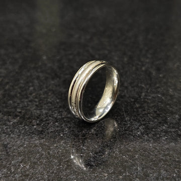 Ferrum ring for men in silver color in pakistan with textured design by Lamha on black surface