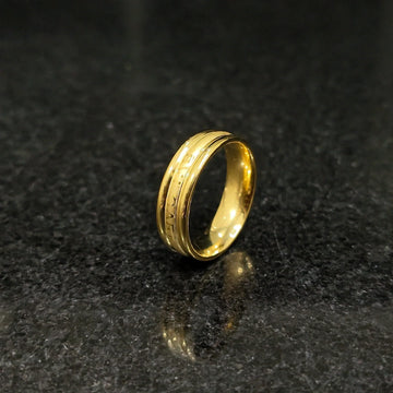 Ferrum ring in golden color in pakistan with polished smooth finish and detailed engravings by Lamha