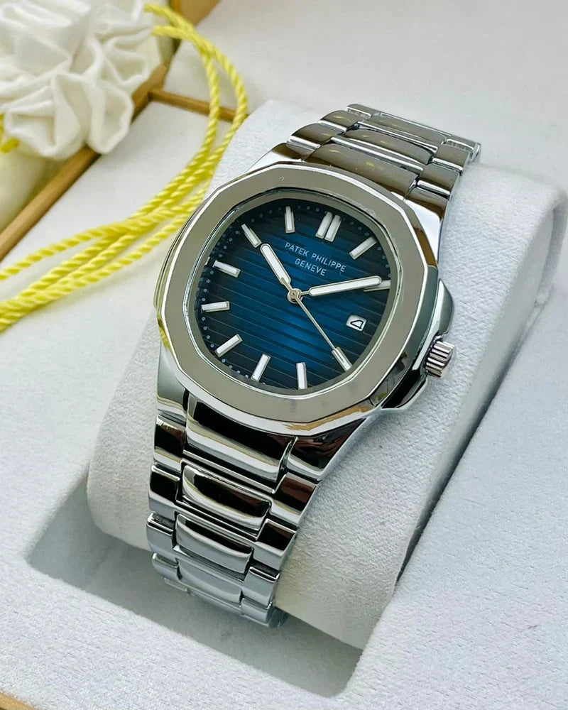 Patek philippe watch in silver blue with stainless steel band and blue dial on display cushion