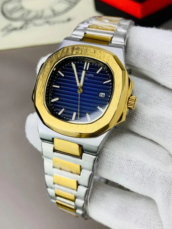 Patek philippe watch in two tone blue color with gold and silver bracelet held by gloved hand