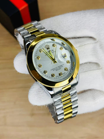 Rolex watch in stone in two tone with gold and silver bracelet held in white glove