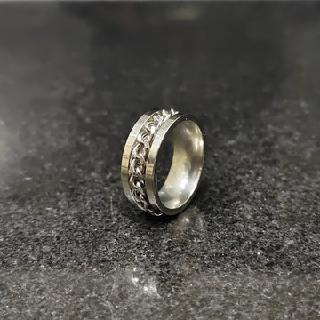 Lamha silver crub chain ring for men in pakistan with a sleek design on a dark surface