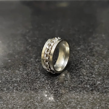 Lamha silver crub chain ring for men in pakistan with a sleek design on a dark surface