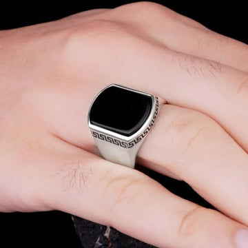Silver versace medusa ring for men with black square center and intricate pattern on band