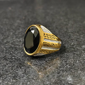 Silver gold oval medusa ring for men with black oval gemstone and intricate gold and silver patterns