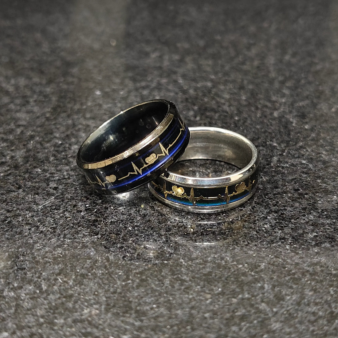 Stylish 2 heart beat rings for men in pakistan featuring black and silver tones with heartbeat design