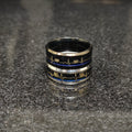Two heart beat rings for men in pakistan with black and silver design by Lamha on a dark surface