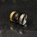 Set of 3 ferrum rings in pakistan by Lamha featuring gold, black, and silver tones on a dark surface