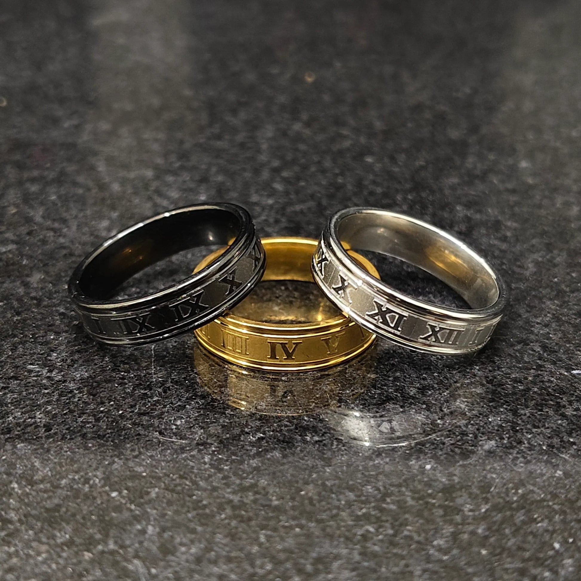 Set of 3 roman rings for men in pakistan by Lamha featuring black, gold, and silver metal finishes
