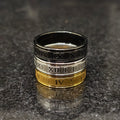 3 roman rings for men in pakistan stacked in black silver and gold with engraved Roman numerals
