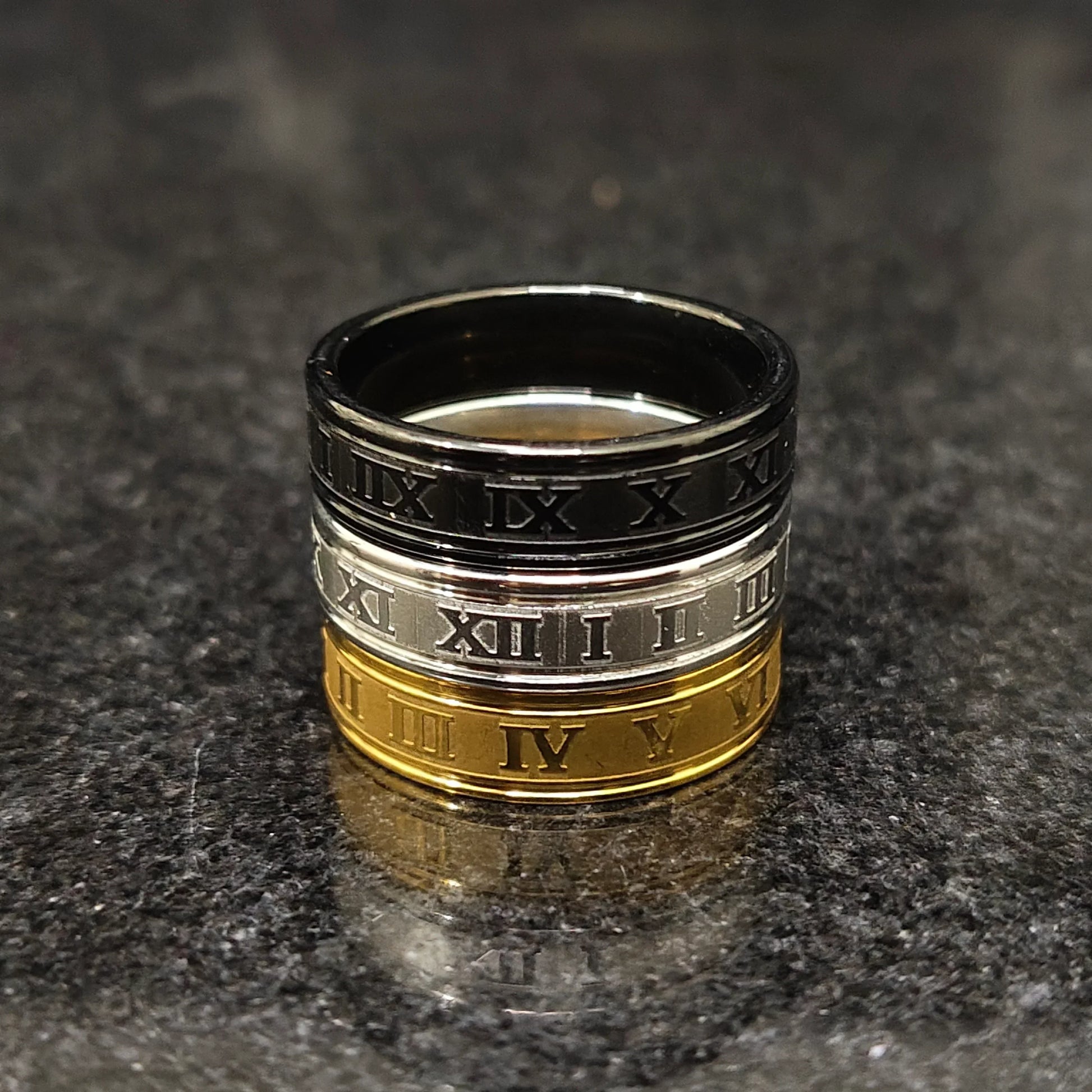3 roman rings for men in pakistan stacked in black silver and gold with engraved Roman numerals