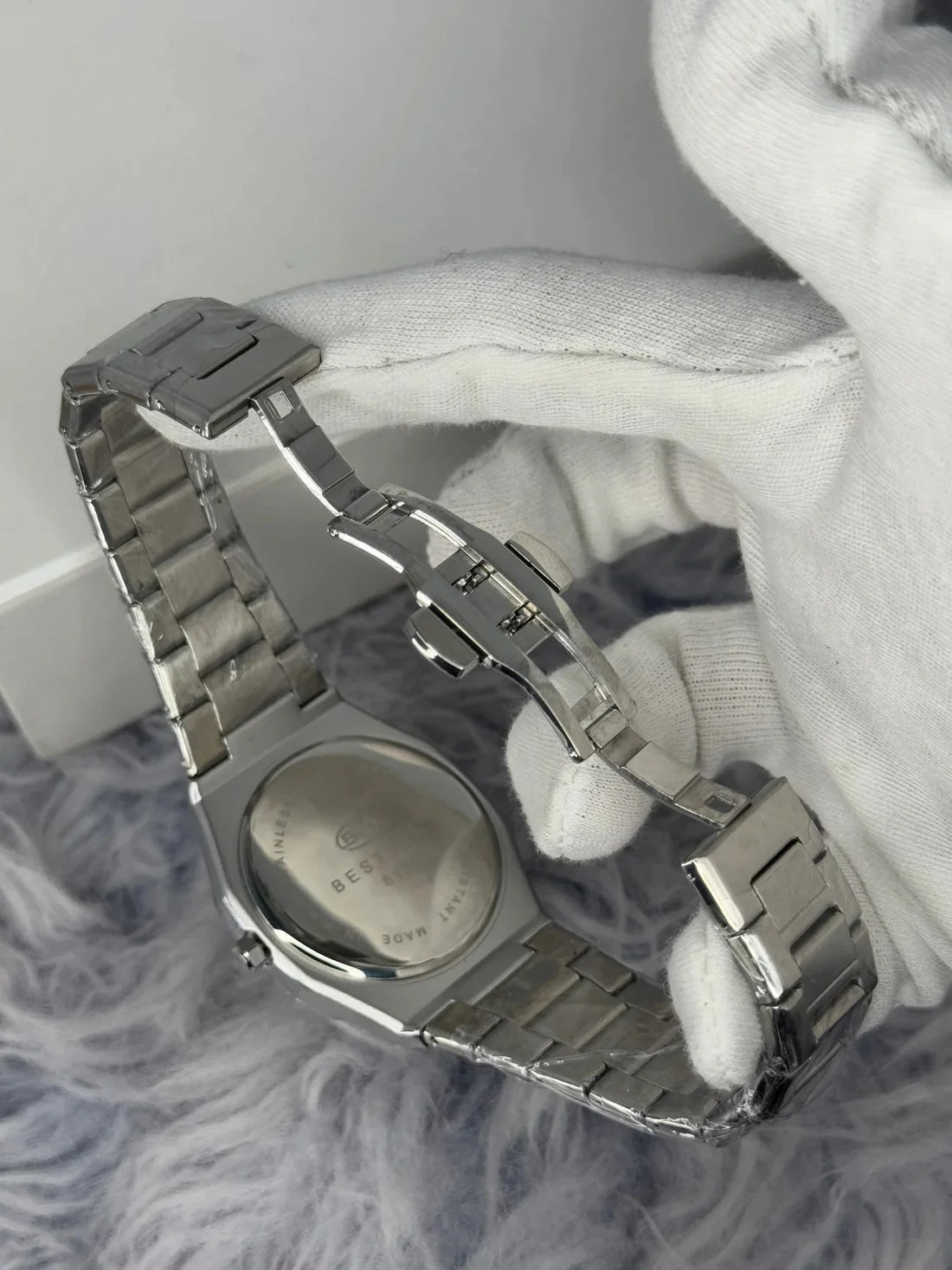 Lamha Bestwin Date Just Watch in Silver White showing the stainless steel clasp and back case
