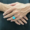 Blue feroza ring for men worn on finger with silver band and detailed design by Lamha