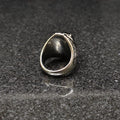 Silver European Ring For Men with intricate design details displayed on dark stone surface