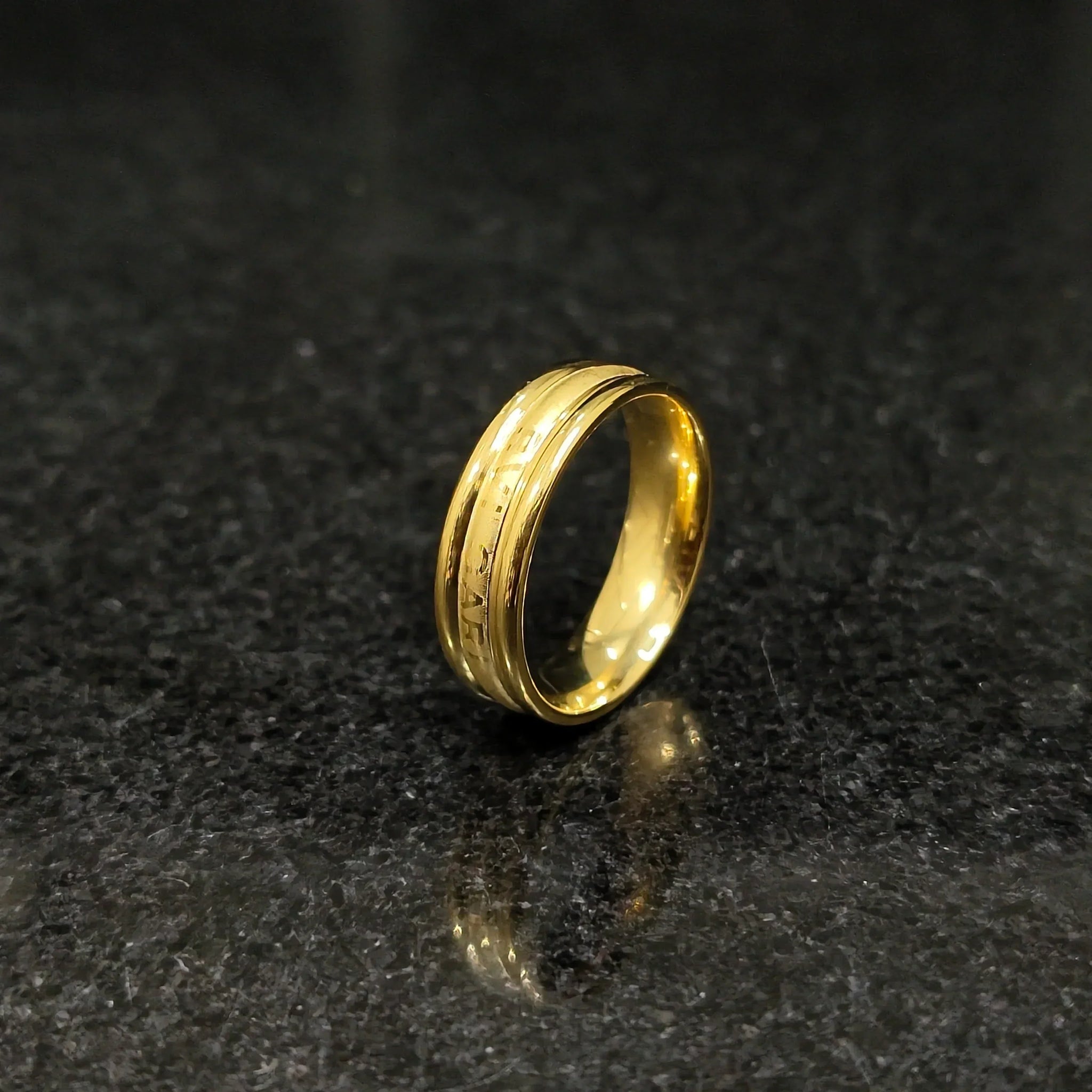 Ferrum ring in golden color in pakistan with polished smooth finish and detailed engravings by Lamha
