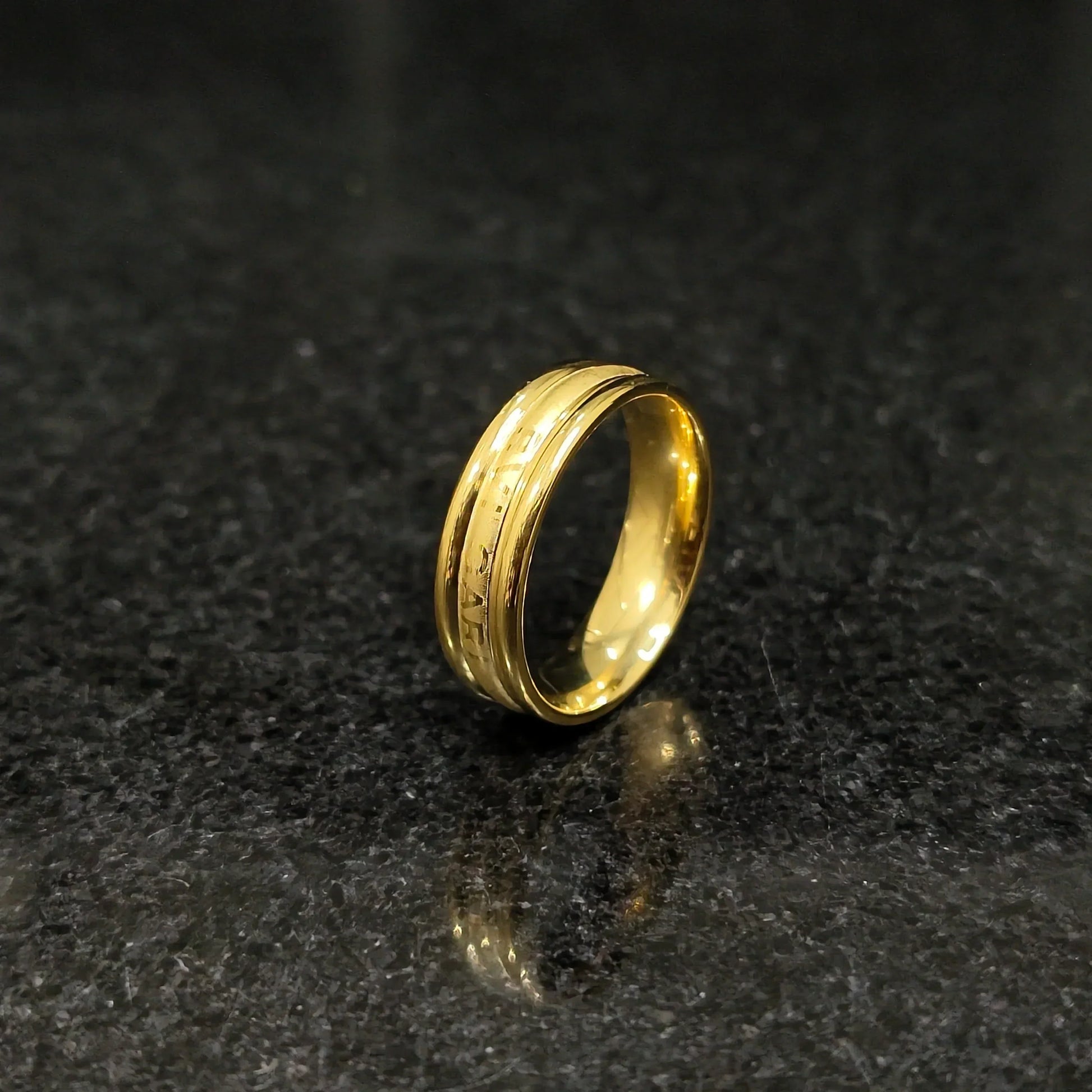 Ferrum ring in golden color in pakistan with polished smooth finish and detailed engravings by Lamha