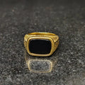 Golden Swiss medusa ring for men with black stone and intricate gold detailing by Lamha