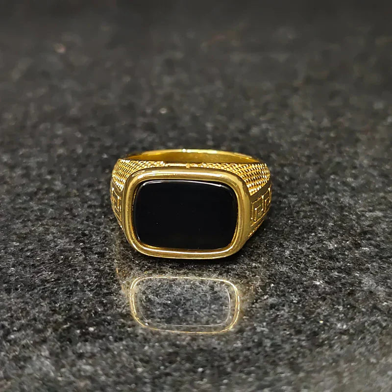 Golden Swiss medusa ring for men with black stone and intricate gold detailing by Lamha
