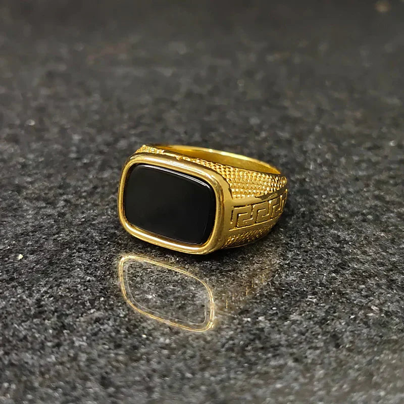 Golden Swiss medusa ring for men with black rectangular stone and intricate gold detailing