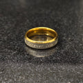 Love ring for men in golden forever color with engraved forever love text on a dark surface