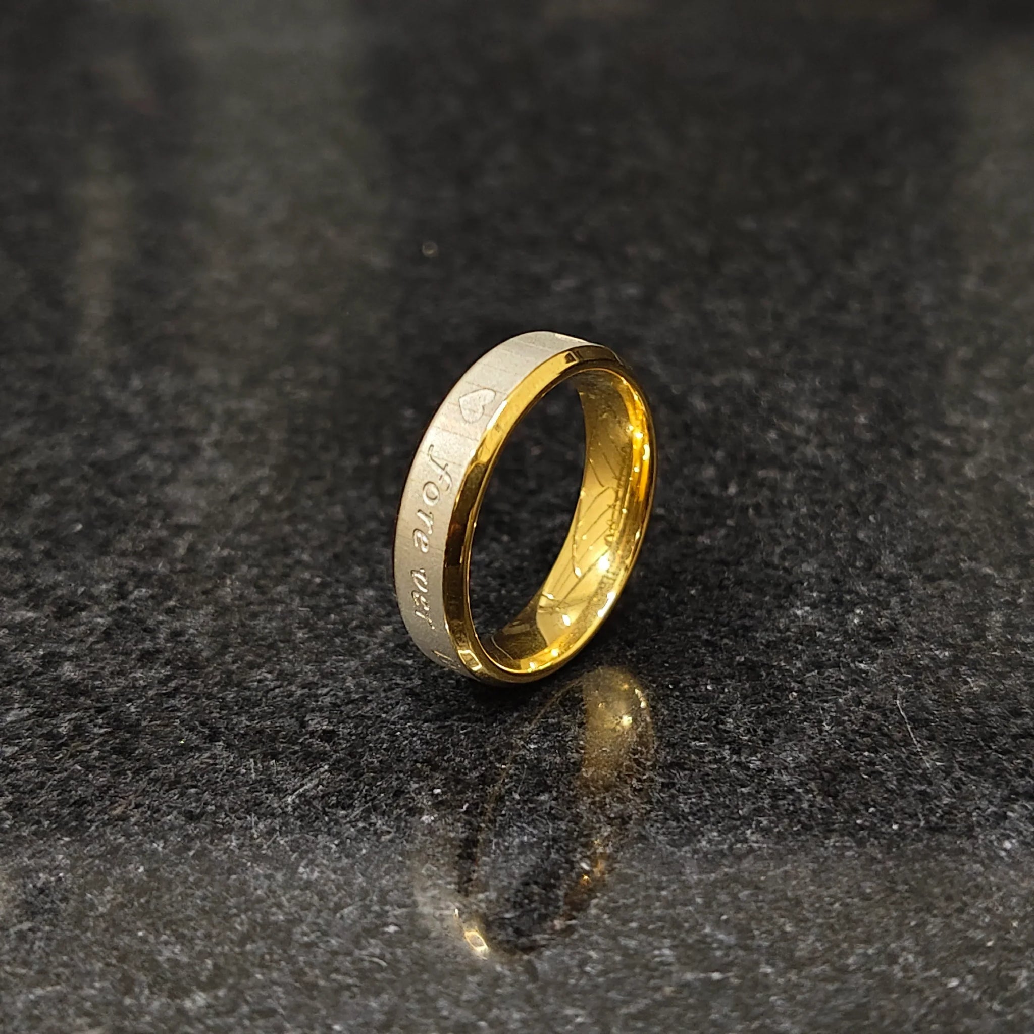 Love ring for men in golden forever color by Lamha with engraved heart design and smooth finish