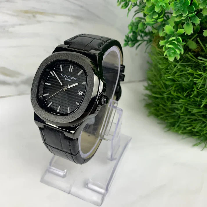 Patek philippe Black strap watch with black dial and silver case displayed on clear stand