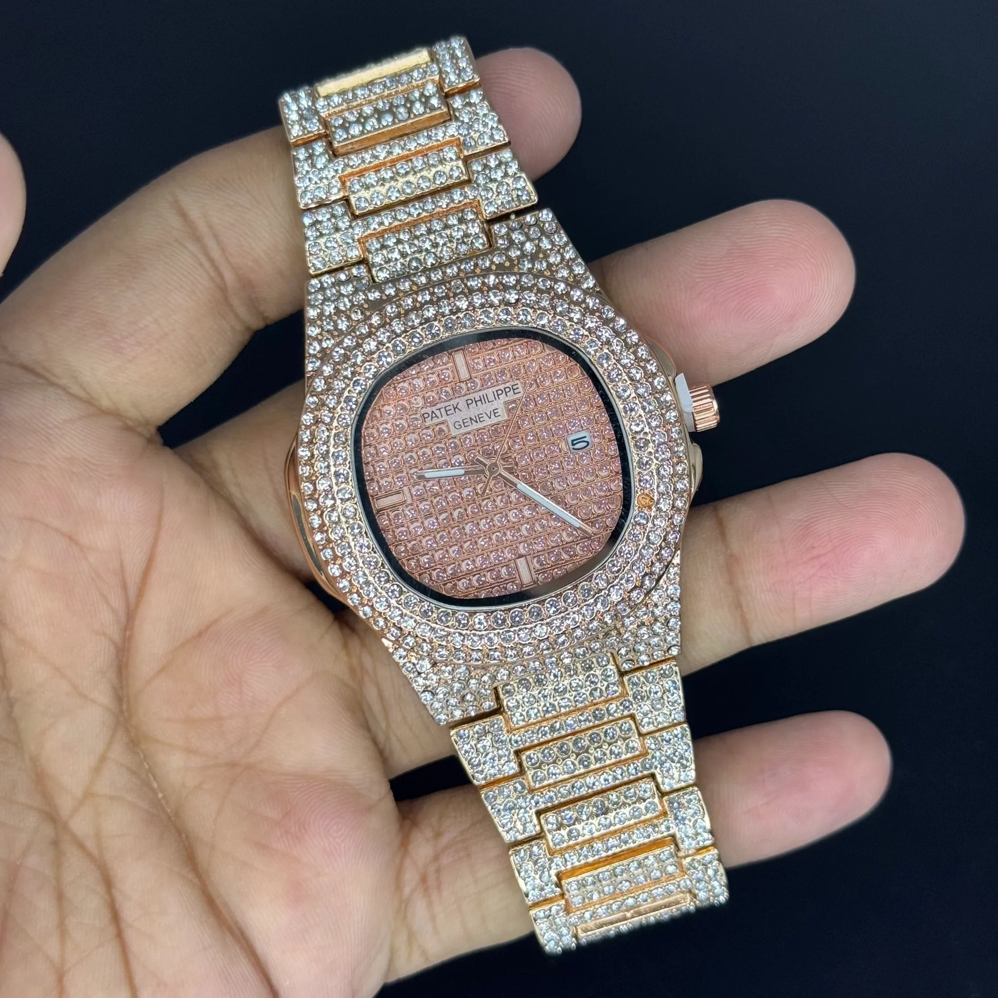 Patek Philippe Ice Dout rose gold Watch with diamond-studded band and face held in hand