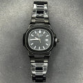 Patek Philippe In Black wristwatch with metal band and date display on textured background