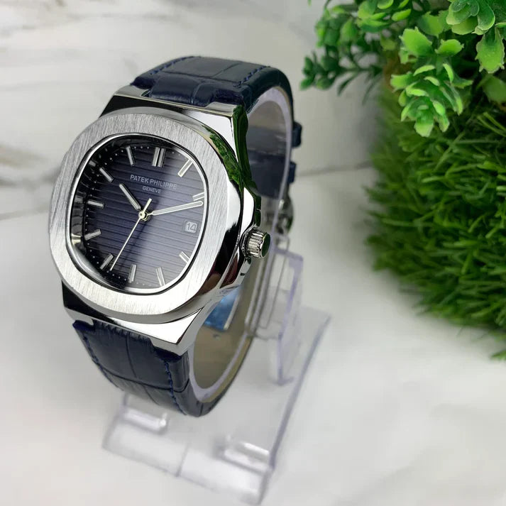Elegant Patek Philippe Watch with blue leather strap and silver case displayed on clear stand