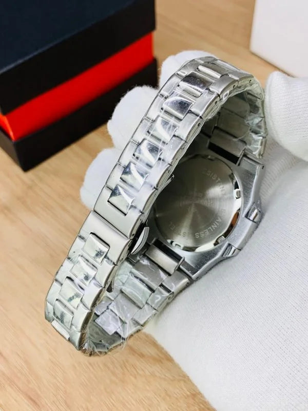 Patek philippe watch in silver blue with stainless steel band and blue dial on display cushion