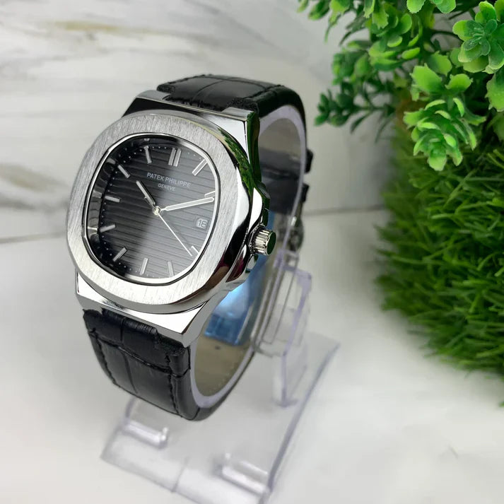 Lamha Petek philippe Silver black strap watch with silver case and black textured dial on display stand