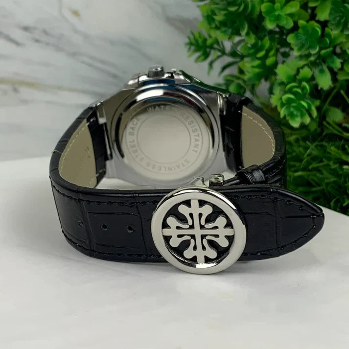 Petek philippe Silver black strap watch showing detailed buckle and leather strap design