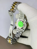 Back view of RLX Oyster Perpetual Date Two Tone Golden watch held by gloved hand