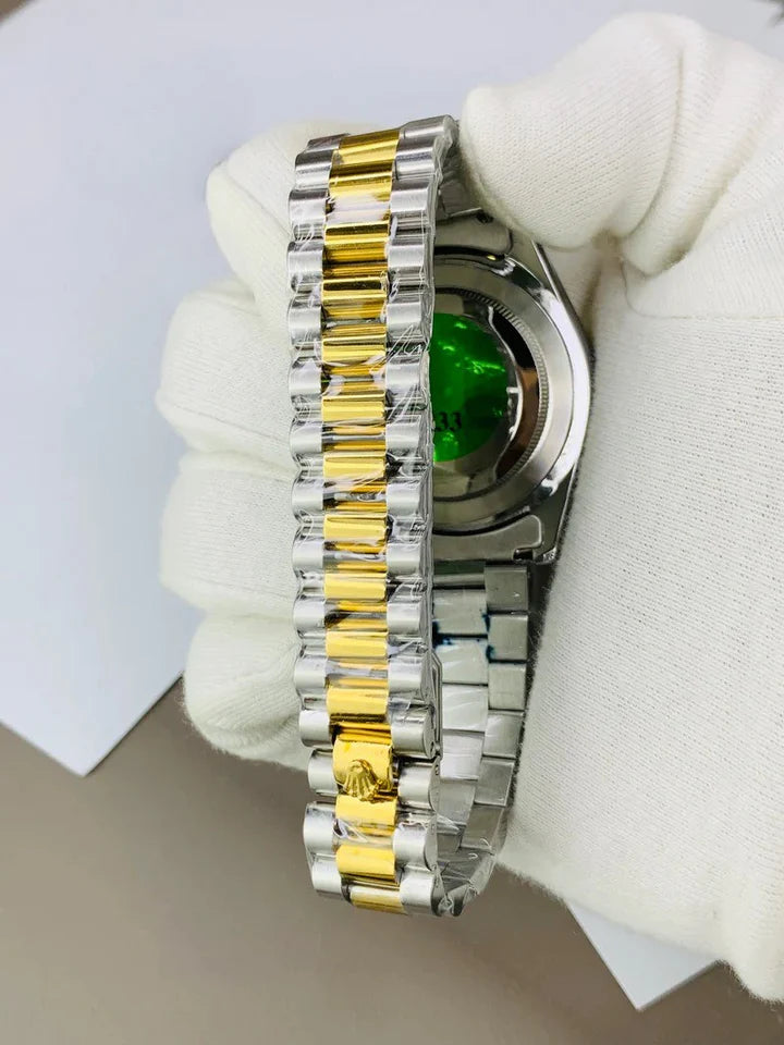 RLX Oyster Perpetual Watch Date Just in Two Tone in Silver showing the backside and two-tone bracelet held by gloved hand
