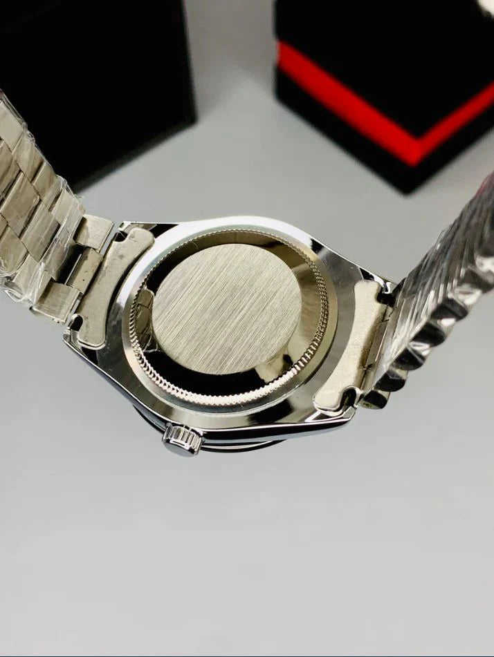 Rolex submariner watch in silver black color showing back stainless steel case and metal bracelet by Lamha