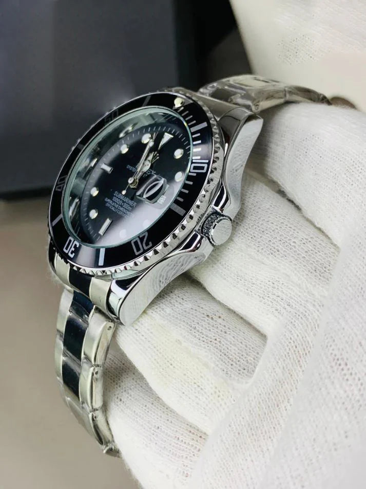 Lamha rolex submariner watch in silver black color with stainless steel band held in white glove