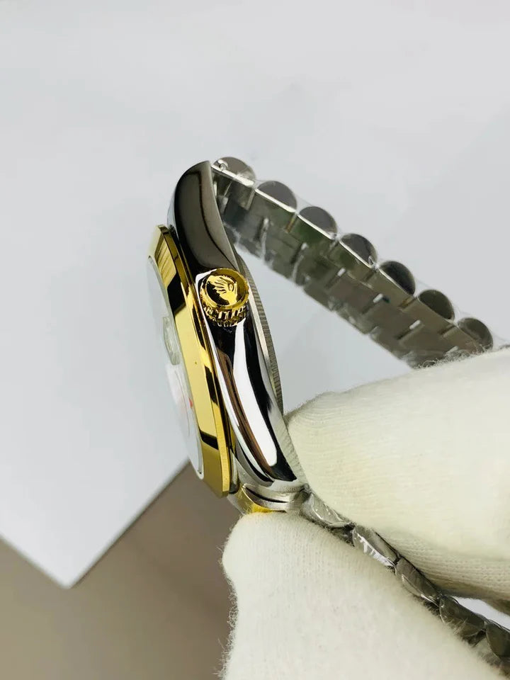 Rolex Watch for Men in Pakistan two-tone gold and silver with diamond hour markers held by gloved hand
