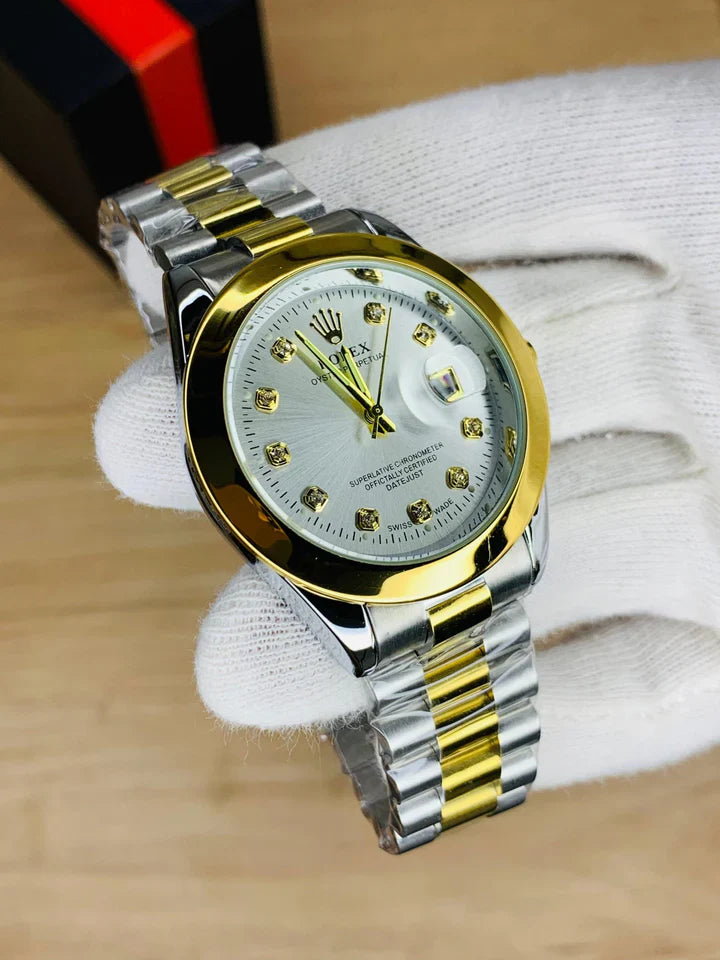 Rolex watch in stone in two tone with gold and silver bracelet held in white glove