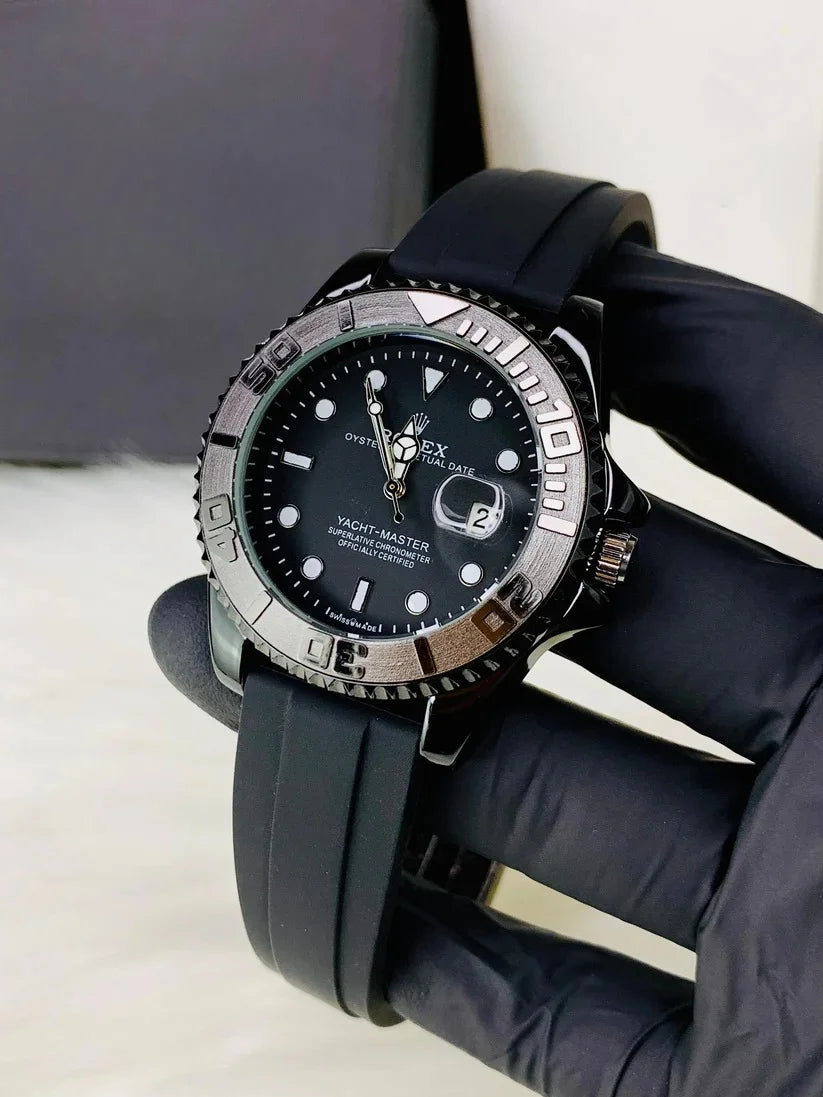 Rolex Yacht Master Date Just full black watch with black rubber strap and silver bezel held by gloved hand