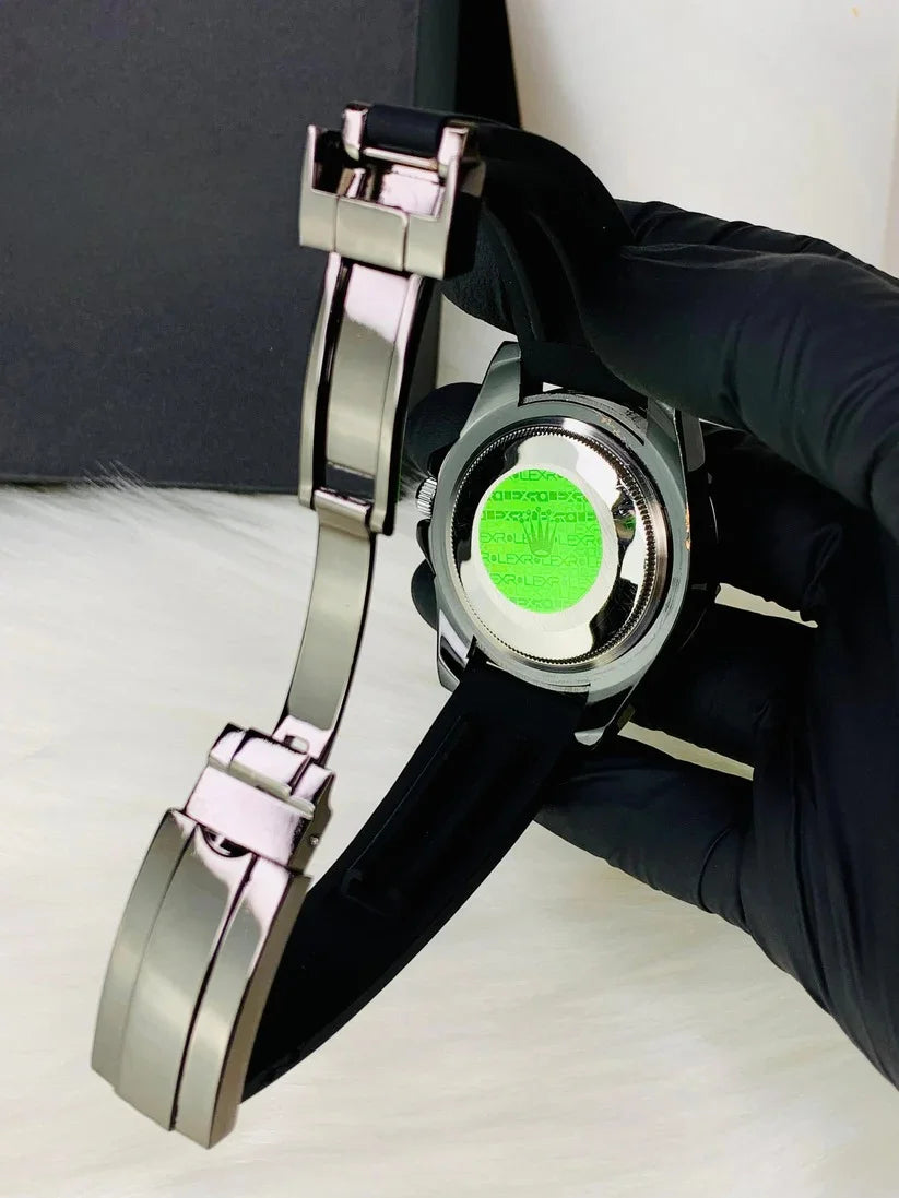 Rolex Yacht Master Date Just Full Black watch with black strap held by gloved hand showing back case