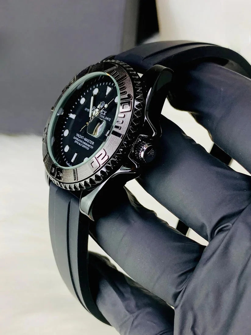 Rolex Yacht Master Date Just Full Black watch with black dial and rubber strap held by gloved hand