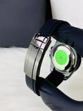 Rolex Yacht Master Date Just Full Black watch held by gloved hand showing detailed clasp and back design