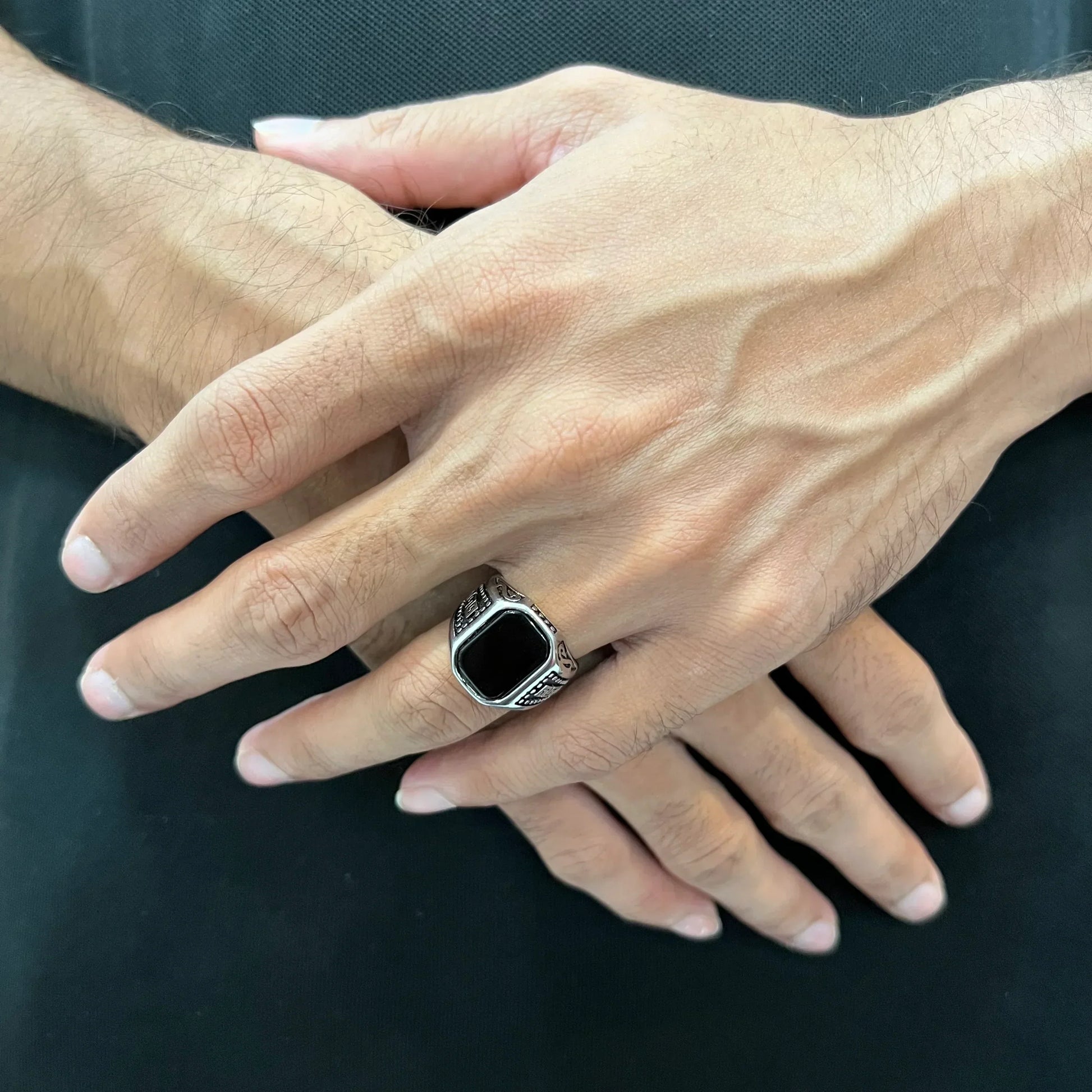 Silver medusa ring for men worn on finger with intricate black stone design by Lamha