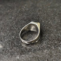 Lamha silver onyx ring for men with a smooth polished finish on a dark textured surface