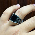 Silver Square Turkish Ring for men with black enamel and detailed textured band on finger