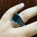 Silver Square Turkish Ring for men worn on finger with black inlay and patterned band