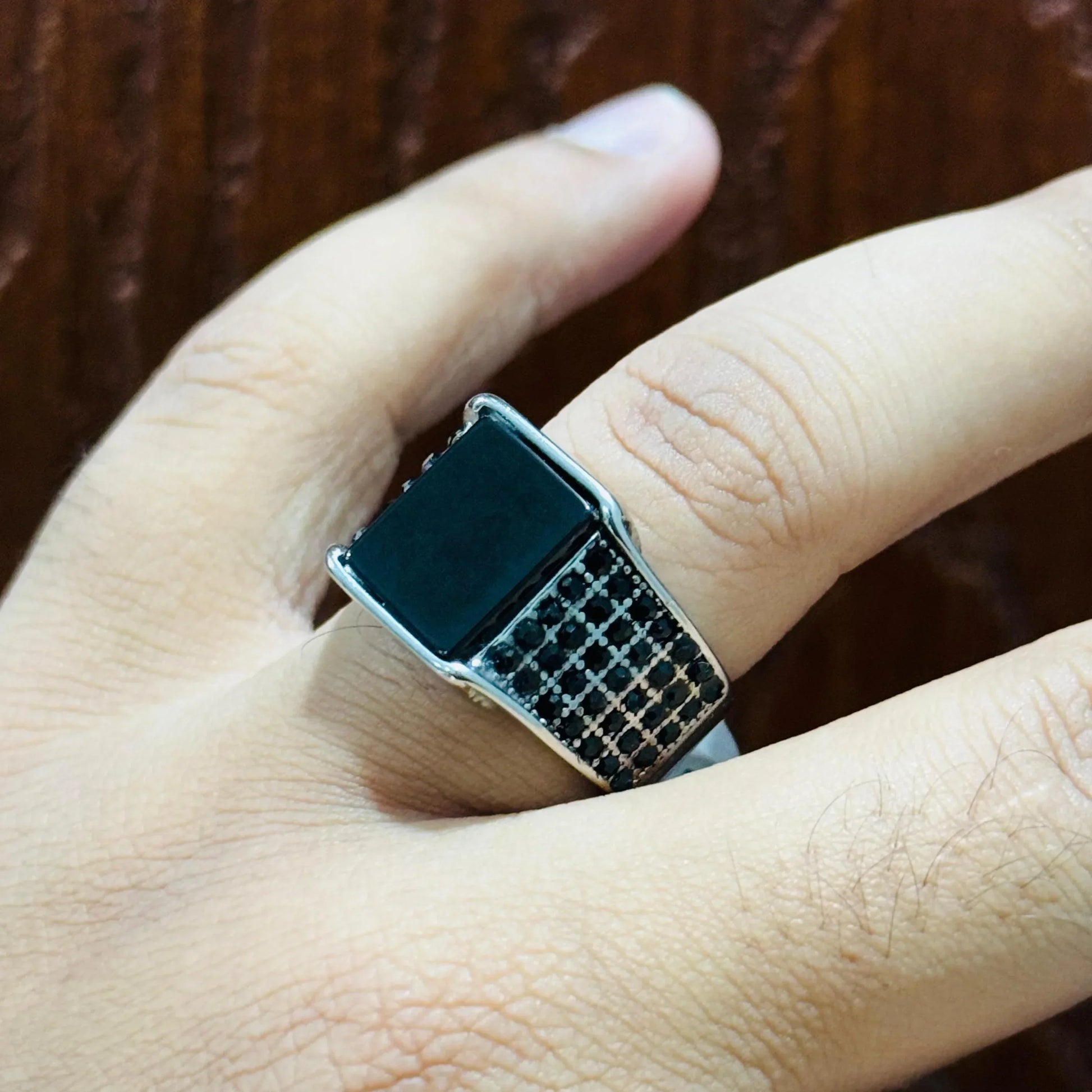 Silver Square Turkish Ring for men worn on finger with black inlay and patterned band