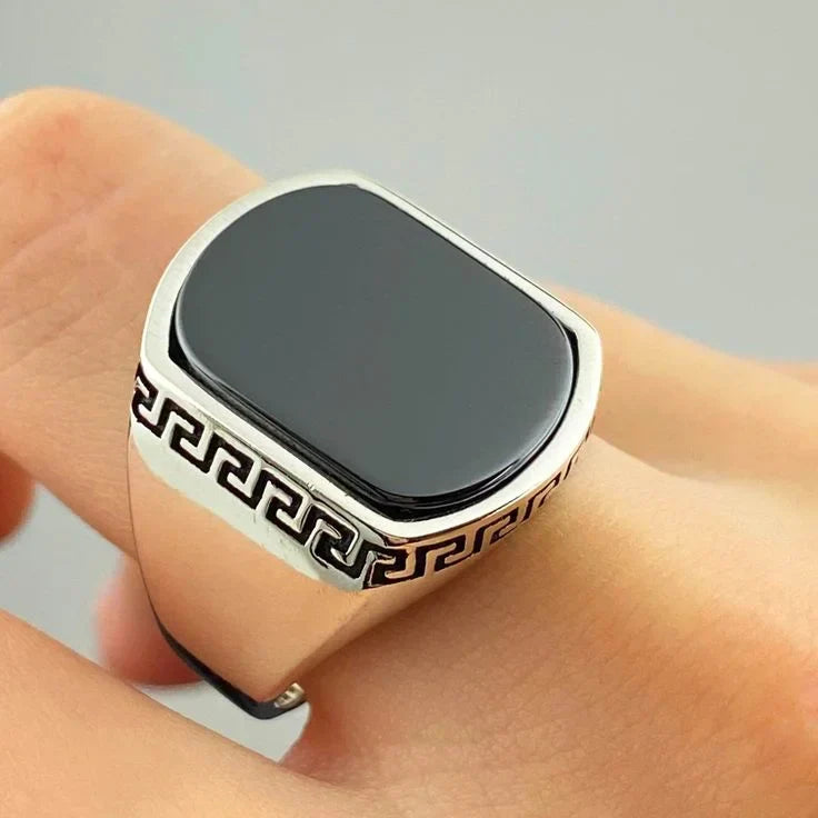 Silver versace medusa ring for men with black stone and intricate Greek key design