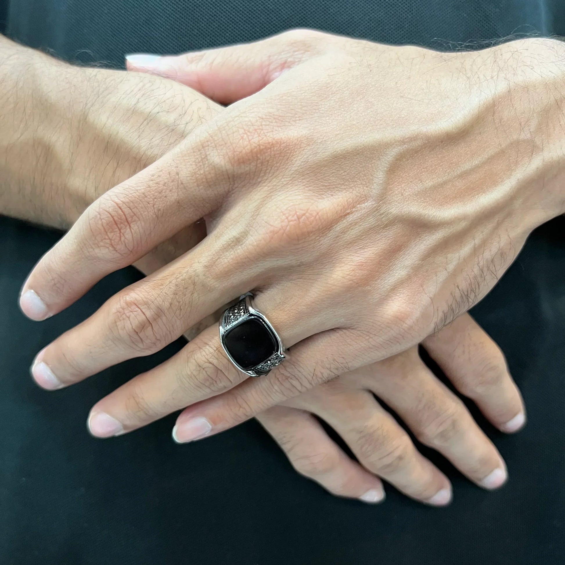 Turkish Ring for Men in pakistan worn on hand with black stone and detailed silver band
